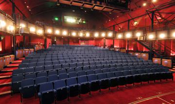 A view of the empty stalls and circle in The Haymarket, taken from the stage