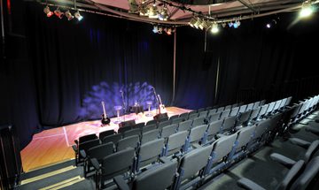 A photo of The Forge auditorium from the back looking onto the stage