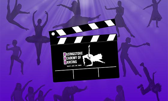 An illustrated image of a clapperboard with a white silhouette of someone dancing and the text 'Basingstoke Academy of Dance' on a dark purple background with darker purple silhouettes of people dancing