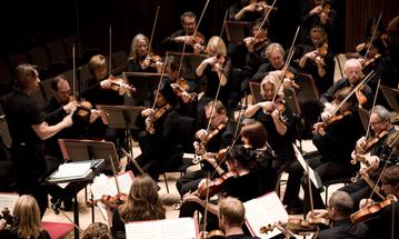 The string section of the Philharmonia Orchestra perform at The Anvil