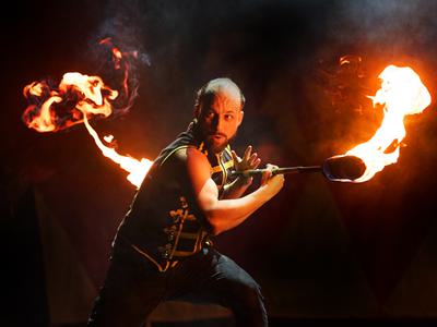 A man doing a trick with fire