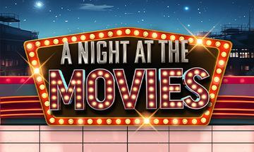 "A Night At The Movies" written inside a black box with a red outline and lights around it. The background is a night sky with stars and buildings