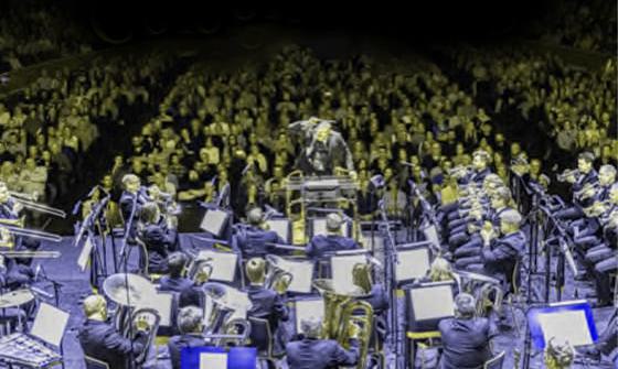 Illustrated image of the Grimethorpe Colliery Band performing on a stage in front of an audience