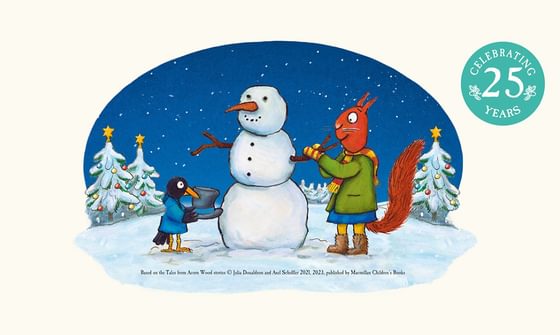 An illustration of a night time wintery scene with a squirrel and blackbird in jackets and scarves building a snowman with decorated pine trees behind that all have baubles and stars. There is a blue bubble in the corner that reads 'Celebrating 25 Years'