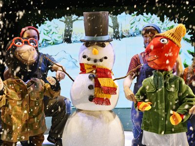 Mole and Squirrel in winter clothes with a snowman between them