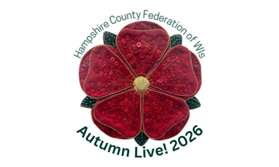 'Hampshire County Federation of WIs Autumn Live! 2026' in green text surrounding a red fabric flower covered in buttons