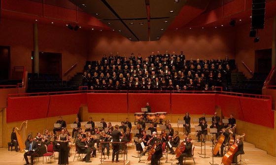 Basingstoke Symphony Orchestra sitting with their instruments.