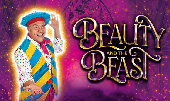 Chris Pizzey as Louis La Plonk, is dressed in a busy blue, yellow and red French-inspired costume. He holds his arms open to his side, showing off the golden title of Beauty and the Beast. The background is of a grand window with a purple filter over it and covered in glittering stars.