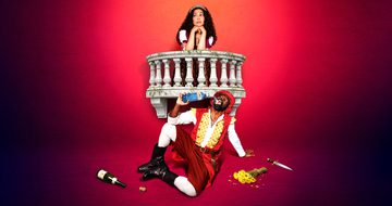 a girl with long curly dark hair leans on a balcony. Below her is a black man on the floor dribking from a gin bottle. Around him is a bunch of flowers, knife and a bottle of wine