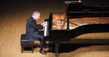 Sir András Schiff at his piano