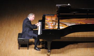 Sir András Schiff at his piano