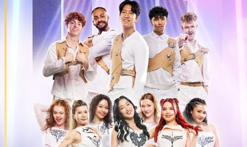 a group of K-Pop stars all in white smiling at the camera