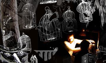 A photo of a man in light clothing with a beard moving a dimly lite object with an orange light on him. The background is black and he is surrounded by eerie white line illustrations of a house in front of him, bird cages hanging above him and a bird-like man with a long nose and large beady eyes wearing a very tall top hat and a Victorian looking coat that covers most of his face.