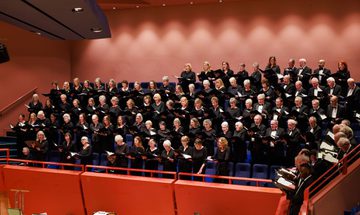 Basingstoke Choral Society singing in the choir stalls at The Anvil