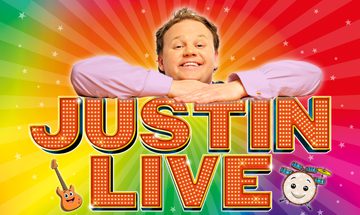 Justin Fletcher on a rainbow swirl background leaning on top of the words 'Justin Live' with a cartoon guitar and drum beneath