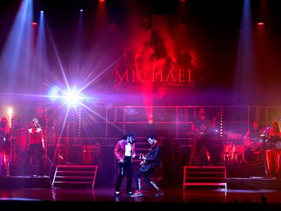Michael Jackson tribute Ben Bowman performing on stage with a guitarist