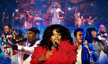 A black woman with thick curly long hair, wears a red feather dress. Behind her are two women and four men all singing into microphones and wearing retro clothing