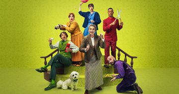 Six people in smart outfits and a dog on and around a short staircase on a green background. Left to right, there is a man in an all green outfit is sat on the stairs holding TNT in one hand and a teacup in the other. There is a woman in all yellow behind him pouring poison into his the green man's cup. There is a dog in a little bow tie sat next to the green man. There is a woman in all blue holding a lawn flamingo above her head looking like she is going to hit the yellow lady with it. There is a woman in beige at the front and centre with a magnifying glass and the other hand is raised with her finger pointing up. A man in all red holding a pair of garden shears open walking down the stairs, a man in all purple is kneeling on the floor placing a banana peel where the red man is about to step