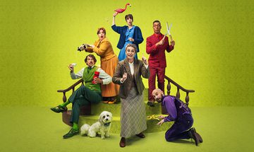 Six people in smart outfits and a dog on and around a short staircase on a green background. Left to right, there is a man in an all green outfit is sat on the stairs holding TNT in one hand and a teacup in the other. There is a woman in all yellow behind him pouring poison into his the green man's cup. There is a dog in a little bow tie sat next to the green man. There is a woman in all blue holding a lawn flamingo above her head looking like she is going to hit the yellow lady with it. There is a woman in beige at the front and centre with a magnifying glass and the other hand is raised with her finger pointing up. A man in all red holding a pair of garden shears open walking down the stairs, a man in all purple is kneeling on the floor placing a banana peel where the red man is about to step