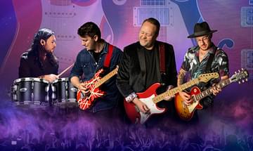 Four musicians performing with guitars and drums, set against a backdrop of large guitars on a purple haze background