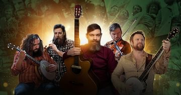 A band of five men with guitars, banjos, and a violin stand against a background of vintage photos, illuminated by a warm, glowing light