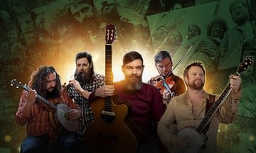 A band of five men with guitars, banjos, and a violin stand against a background of vintage photos, illuminated by a warm, glowing light