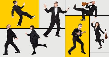 Seven members of The Ukulele Orchestra in tuxedos, and black outfits all in a different silly position, three are holding ukuleles. They're on a background of different sized grey rectangles with two yellow ones