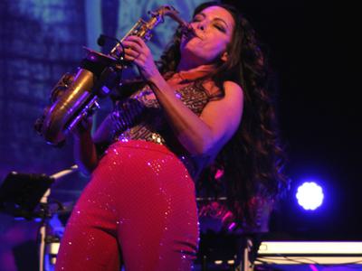 A woman playing a saxophone