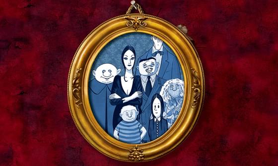 On a red wall hangs a golden circular picture frame containing a blue illustration of the Addams Family