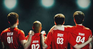 Four men, Ryan, Jason, Andy and Deano stand with their arms around each other, wearing red football shirts, as they look into the distance