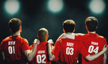 Four men, Ryan, Jason, Andy and Deano stand with their arms around each other, wearing red football shirts, as they look into the distance