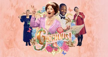 Wendi Peters in a pink dress and tiara singing with her arms held up, next to her is Matthew James Morrison in a white suit and black bowtie. Both are surrounded by pink and blue flowers and butterflies with 'Glorious' in large gold text under them on a pink background. Next to them are also two other female cast members, one looking lovingly and one with her fingers in her ears.
