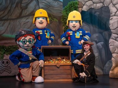 Fireman Sam and his friends crowded around a treasure chest.