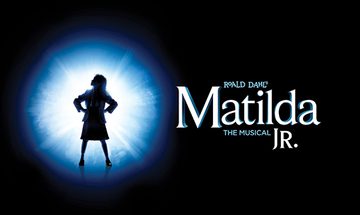 the words "Roald Dahl's Maltilda JR. The Musical" over a black background. A shadow of a girl with hands to hips looks to the left with a blue circle around her