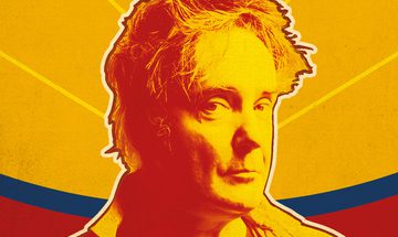 a Pop Art style image of Dylan Moran from shoulders up. The colours are vibrant orange, red and yellow