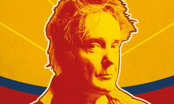 a Pop Art style image of Dylan Moran from shoulders up. The colours are vibrant orange, red and yellow