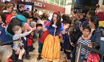 Snow White greeting the crowd in the shopping mall